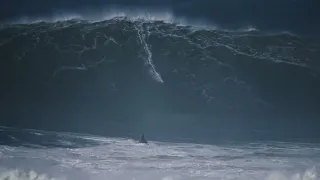 LUCAS CHUMBO on a huge wave in Nazaré during XXXL swell on 25th February 2022