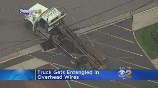 Truck Entangled In Power Lines