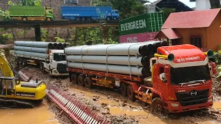 KIRIM PAKU BUMI KE PROYEK JEMBATAN ‼️🔥RC TRUK HINO TRAILER DAN QUESTER MELEWATI JALAN BERLUMPUR