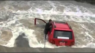 Raw Video: Man Rescued From River in China