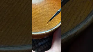 Retouching violin top