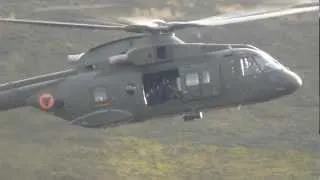 Skyfall armed men waving from helicopter