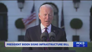 Biden signs $1T infrastructure deal with bipartisan crowd