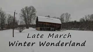 Plowing snow.  Late march snowfall on the farm.