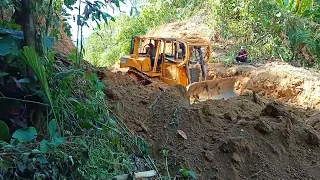 The highest Risk Job CAT D6R XL Cutting Hill On Mountain Road Construction