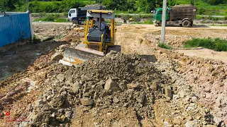 Show Great New Project Komatsu D31P Bulldozer Spreading Gravel​ On Road Which Have Mud