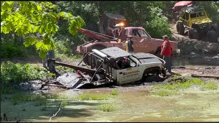 Off Road Wrecker buried in the mud 44 inch tires covered