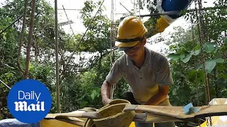 Footage shows workers building the world's longest water slide