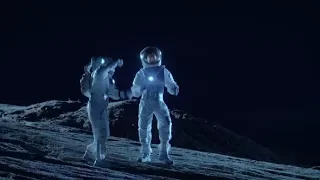 Male and Female Astronauts Wearing Space Suits Dance on the Surface of the Alien Planet | Stock