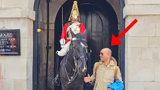 Guard Told this Horrible Tourist Off for Grabbing Horse Throats