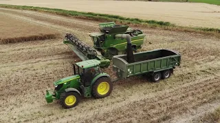 A pair of John Deere S790i Combines Collecting Rape Seed