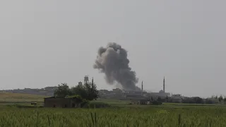 Smoke billows following reported shelling on Syria's Hama