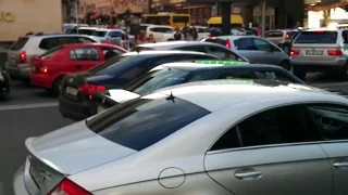 People playing Yellow Submarine with car horn in traffic jam