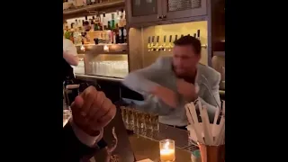 Conor McGregor shadowboxing in a random bar