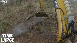 Desilting The Drainage Ditch And Removing Fallen Trees From A Trench With An Excavator - Cabin View