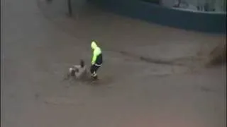 Lady Gets Owned Trying To Cross Flooded Street FAIL