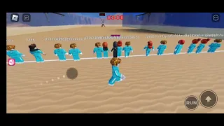 playing squid game in roblox.