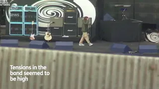 Liam having a bit of an argument with Noel during the Loch Lomond soundcheck in 1996