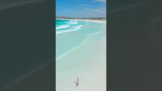 Breathtaking Drone View: Girl and Dog's Joyful Run on Wharton Beach, Esperance