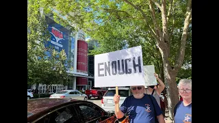 Protestors gather outside NRA event