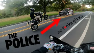 wheelies BY THE COPS! DRZ400 Rider doesn't give a F@!*k!!