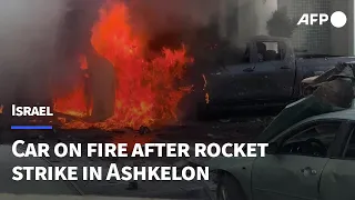 Car on fire after rocket strike in Israel's Ashkelon | AFP