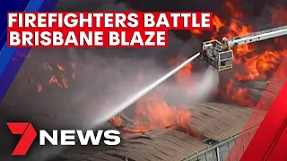 Fire crews battle huge Hemmant blaze | 7NEWS