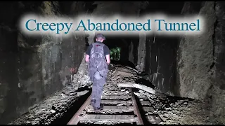 Abandoned Railroad Tunnel with Rails Still Intact