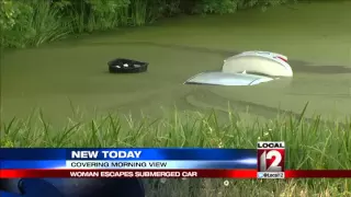 Car drives into pond in Morning View