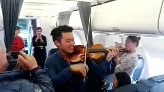 Professional violinist gives performance for passengers on delayed flight