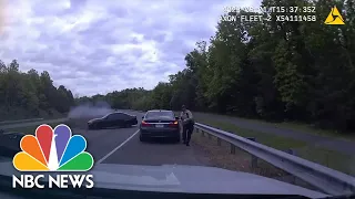 Watch: Car spins out of control crashing into officer making traffic stop
