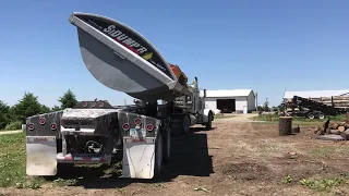 Side Dump Trailer with logs