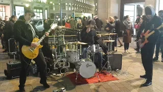 Busking band plays Stairway to Heaven at Oxford Circus, London under the Xmas lights (20 Dec 2018).