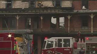 Historic building partially collapses following large fire