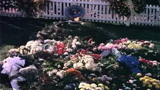 Crowds walking past John Kennedy's grave in Arlington National Cemetery. HD Stock Footage