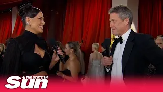 Hugh Grant gives a hilariously awkward Oscars red carpet interview