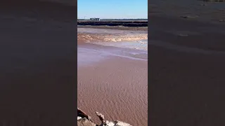 Surging from Fundy Bay this was taken as the tidal bore passed a wide flat plain with ice islands.