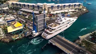 Super yacht "Utopia" squeezing through the St Maarten bridge!