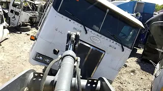 Crushing at a Semi Truck Junkyard