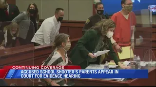 Parents of accused school shooter appear in Michigan court for evidence hearing