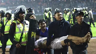 At least 174 dead after fans stampede to exit Indonesian football match