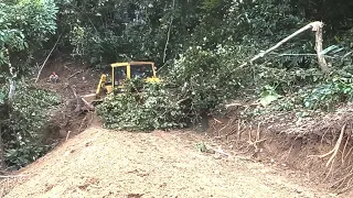 Cat D6G Bulldozer Makes A Road In The Mountains