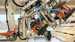Robot drills hole in pallet