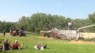 2 threshing machines in action