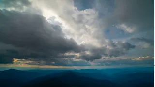 the mountain landscape on the cloud flow background time lapse