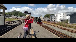 Ffestiniog railway. 27/06/2022. Train leaving Porthmadog as a woodland wonderer.