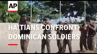 Haitians confront Dominican soldier at the border