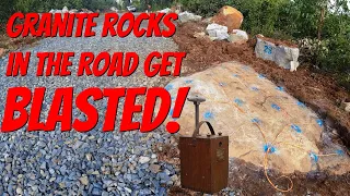 Granite rocks in the road get Blasted