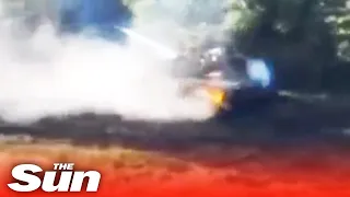 Flaming Russian tank flees as Ukrainian forces attack with missiles