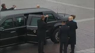 President Trump assists First Lady Melania Trump into limo